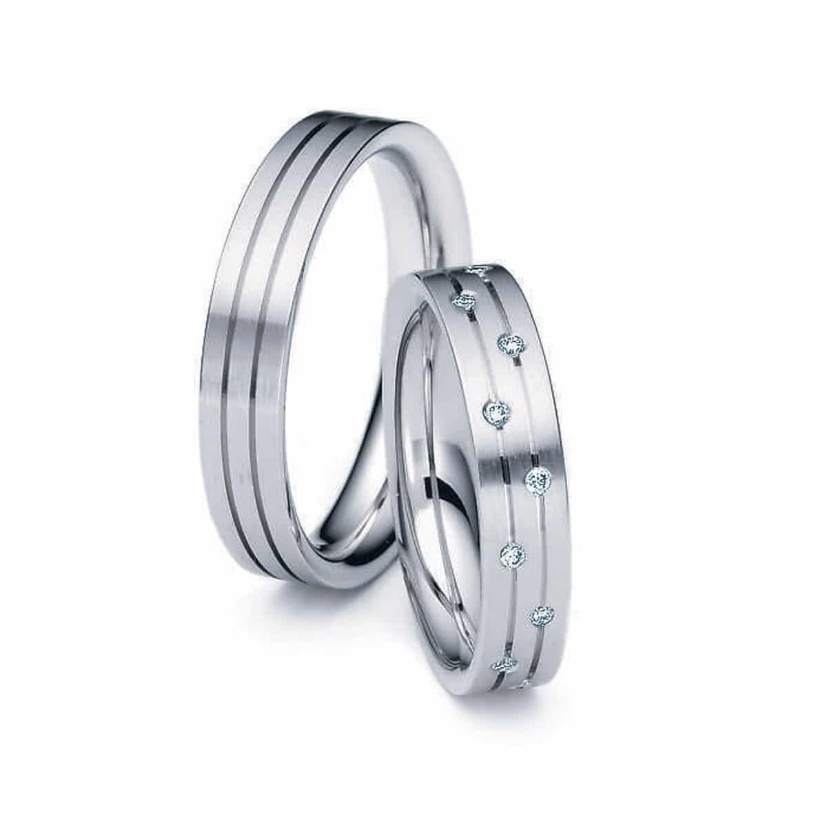 Thick White Gold Wedding Ring With Tiny White Diamonds Sparse Around Band