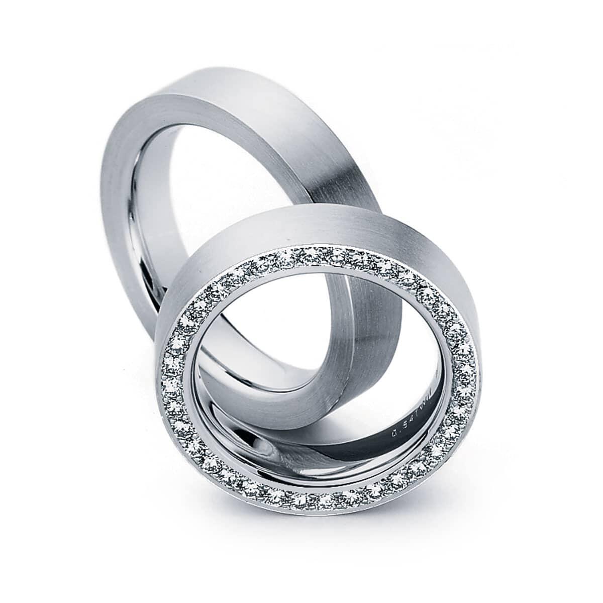 Thick White Gold Wedding Ring With Tiny White Diamonds Under Band