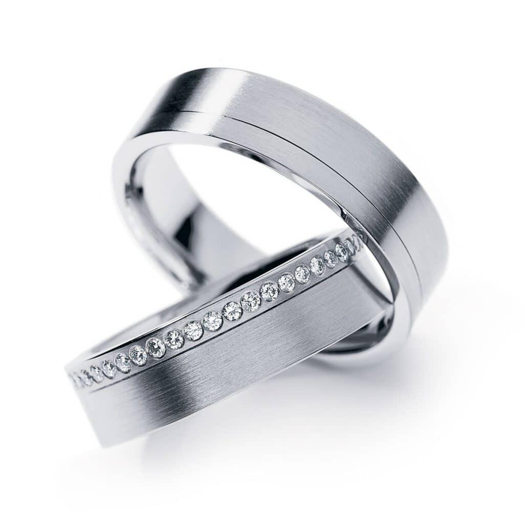 Thick White Gold Wedding Band With Tiny White Diamonds Around Band